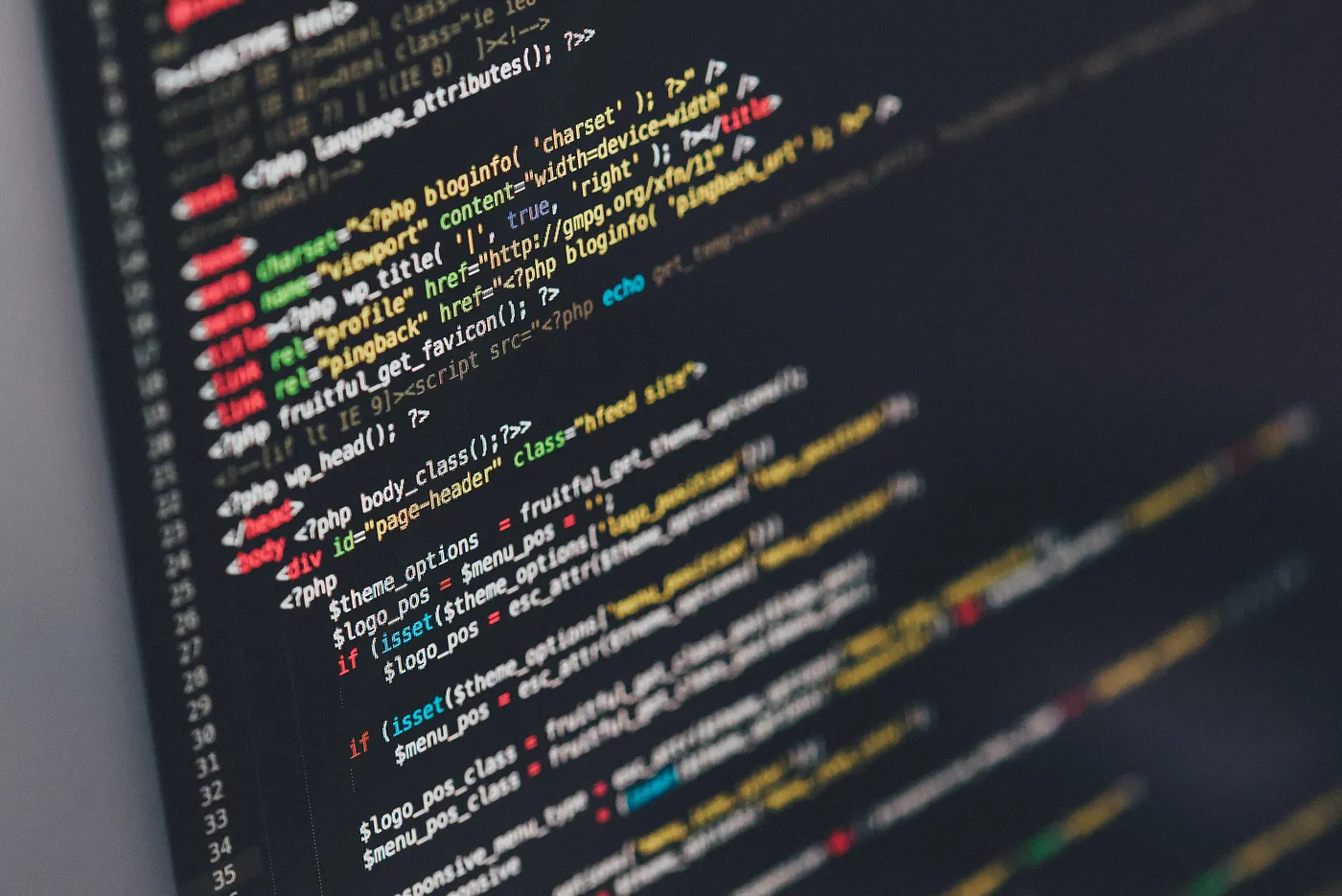 Developer workstation with code on a laptop screen